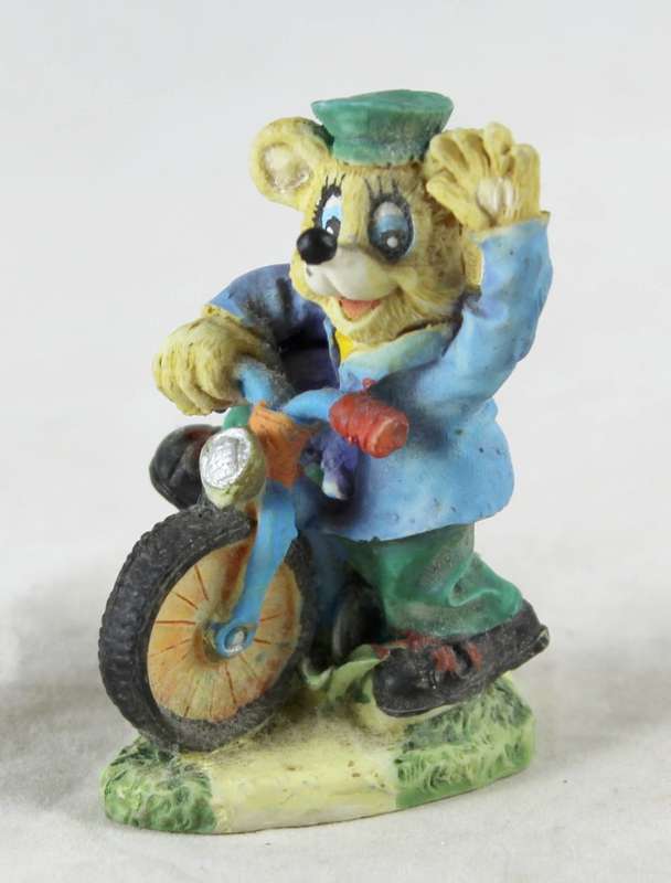 Miniature bear on bicycle