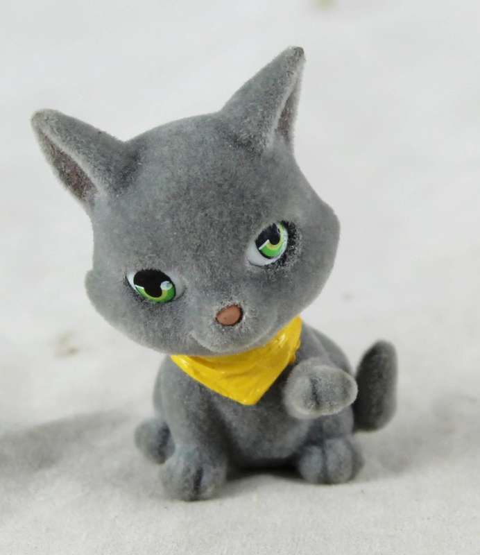 Miniature suede kitten with yellow cravat