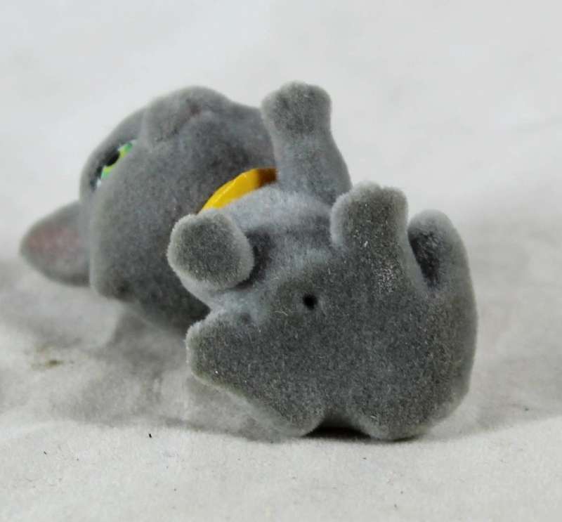 Miniature suede kitten with yellow cravat