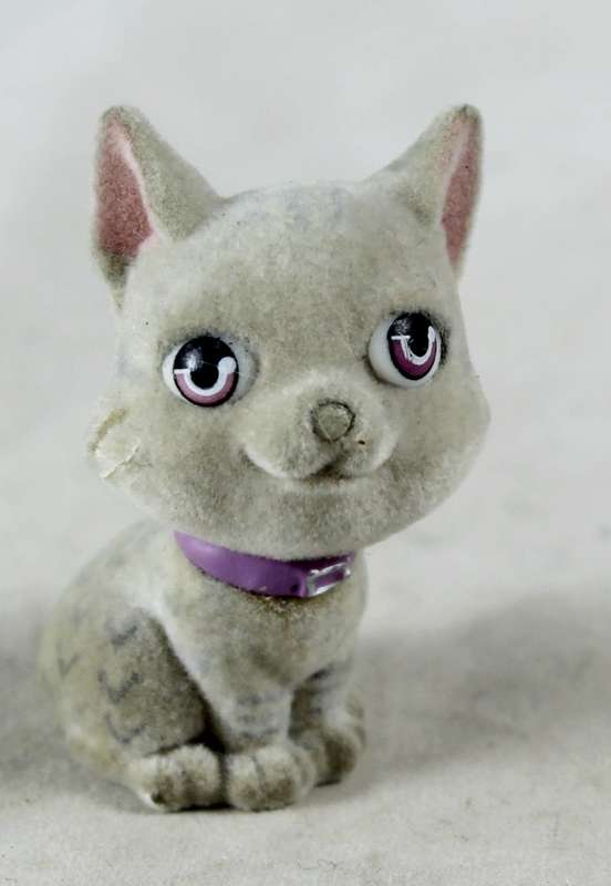 Miniature suede kitten with purple collar