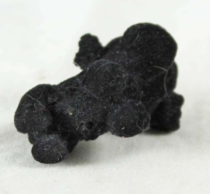 Miniature suede black puppy