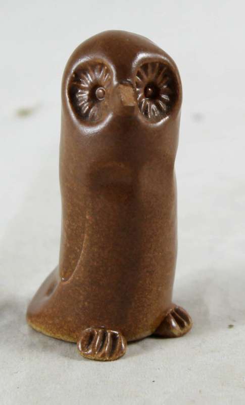 Miniature tall brown owl
