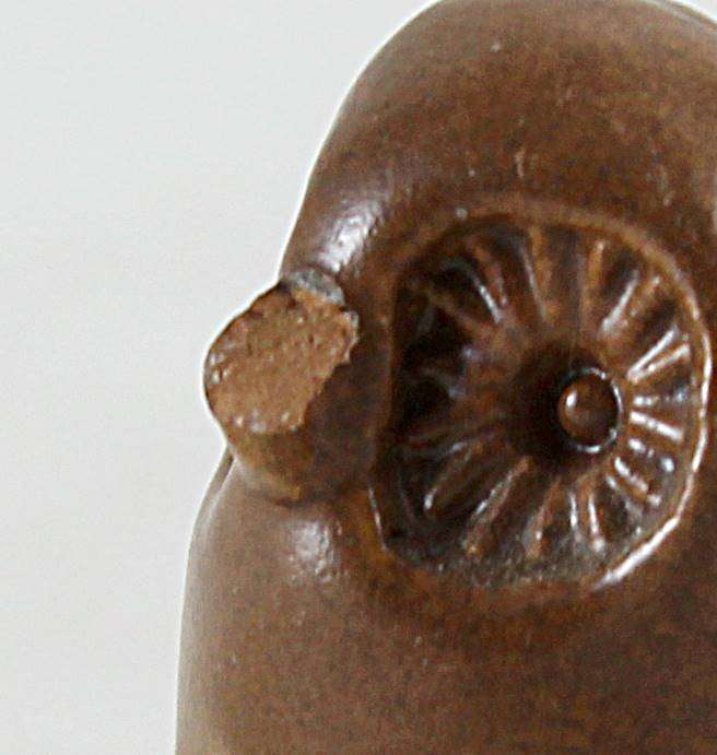 Miniature tall brown owl