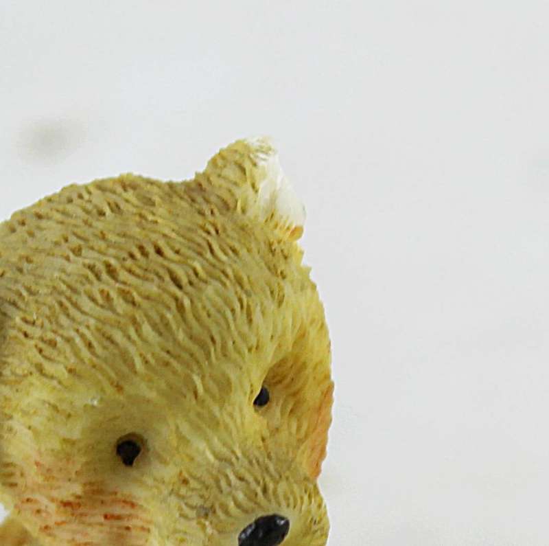 Miniature seated bear