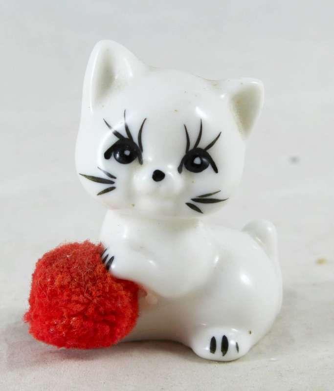 Miniature cat with ball