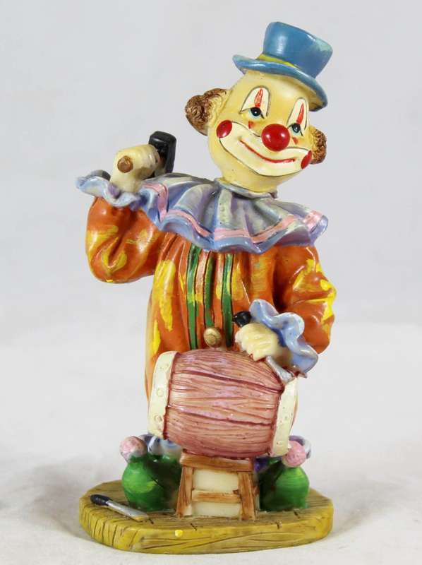 Clown figurine playing a drum