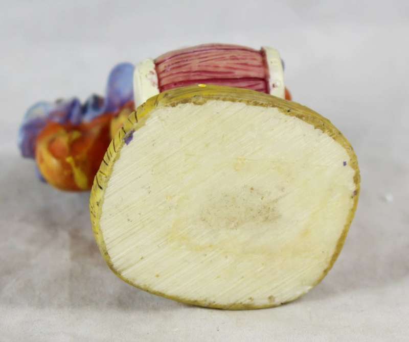 Clown figurine playing a drum