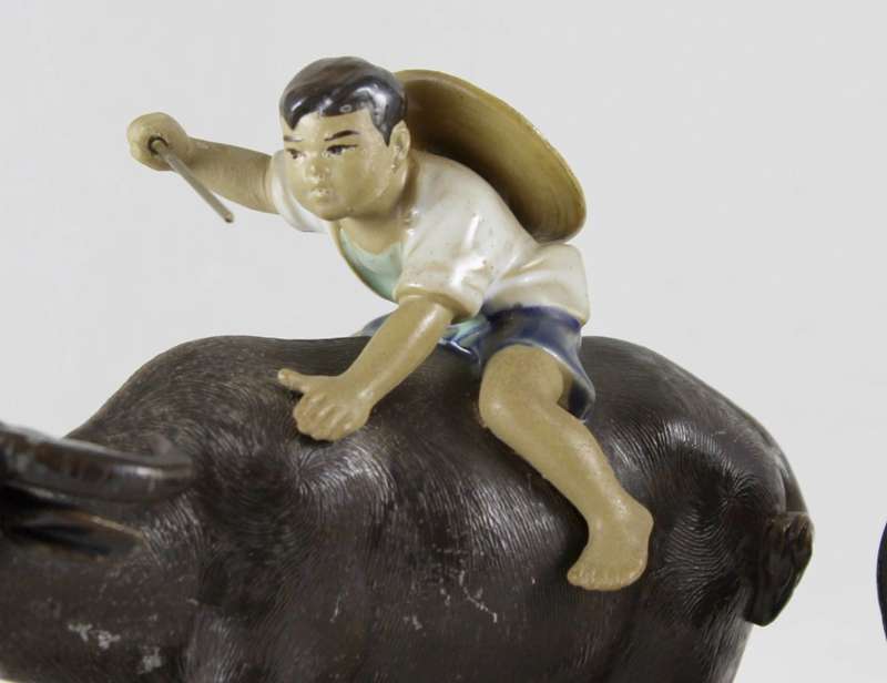 Mudmen - pair of children on bulls