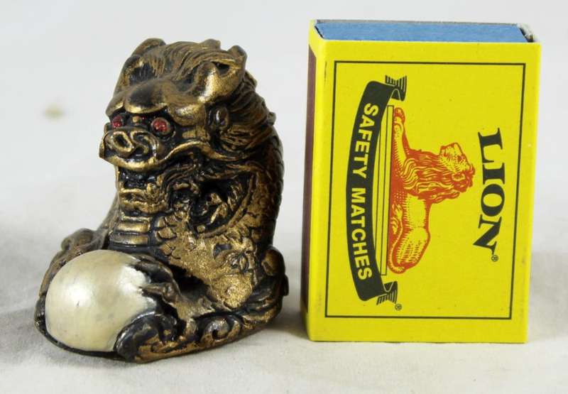 Small gold dragon with crystal ball