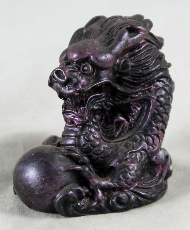 Small purple dragon with crystal ball