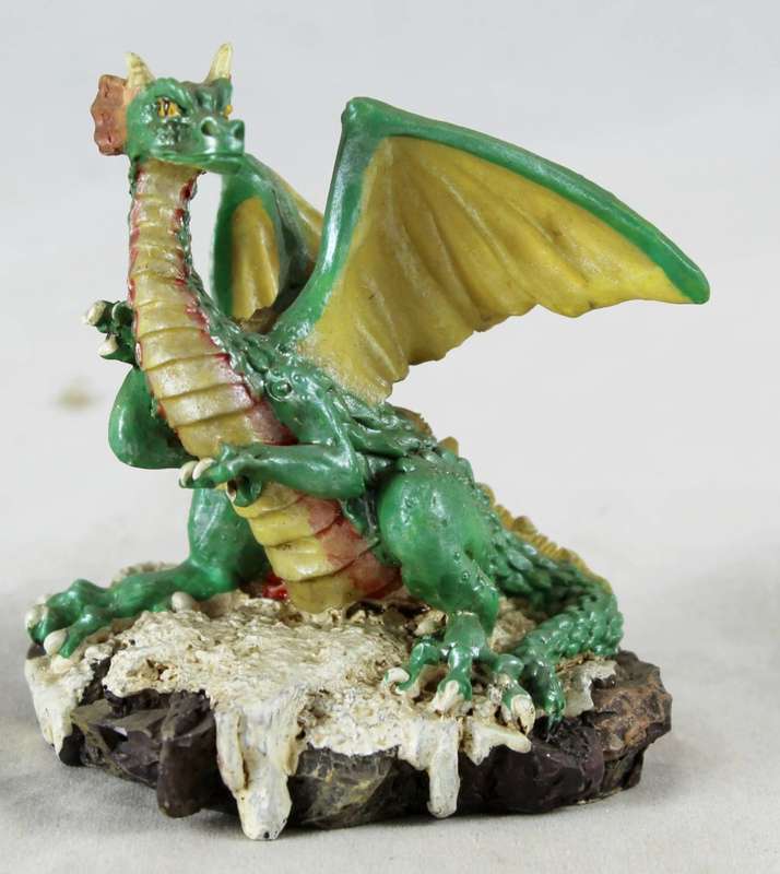 Green dragon on rock