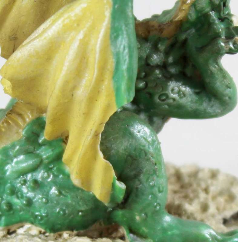 Green dragon on rock
