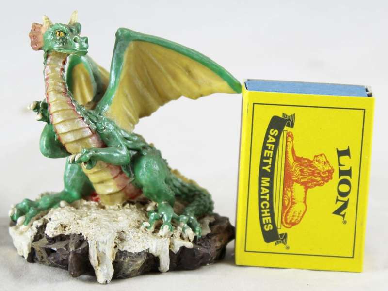 Green dragon on rock