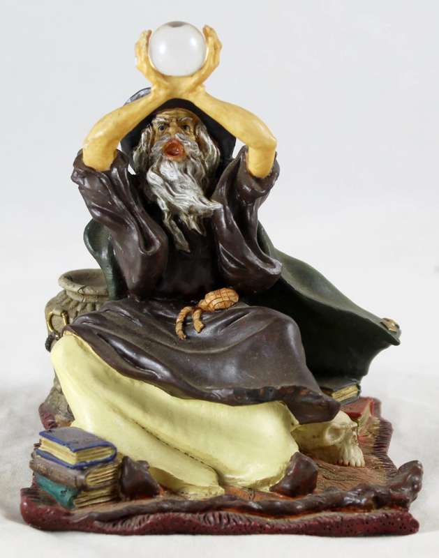 Wizard holding up crystal ball