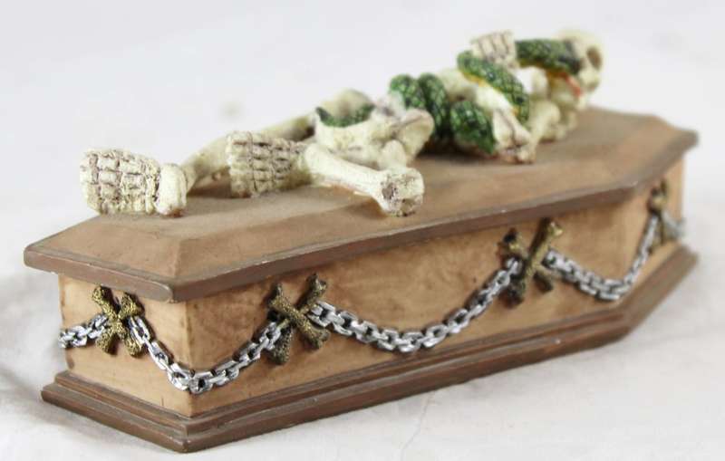 Wooden coffin with skeleton