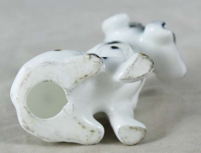 Porcelain Dog with Newspaper - Gorgeous!