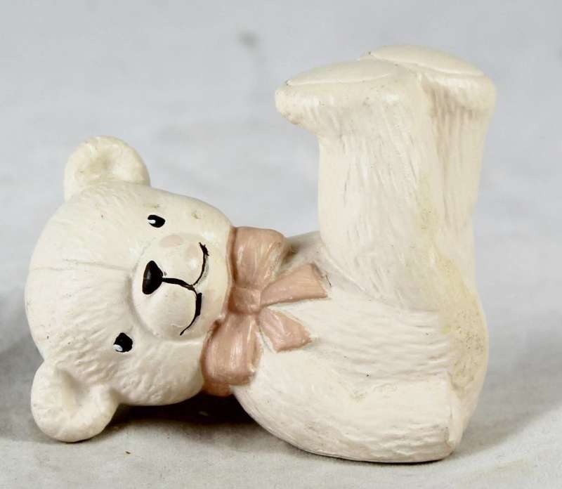 Pink bear with legs in the air