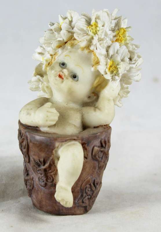 Baby with white and yellow flower hair