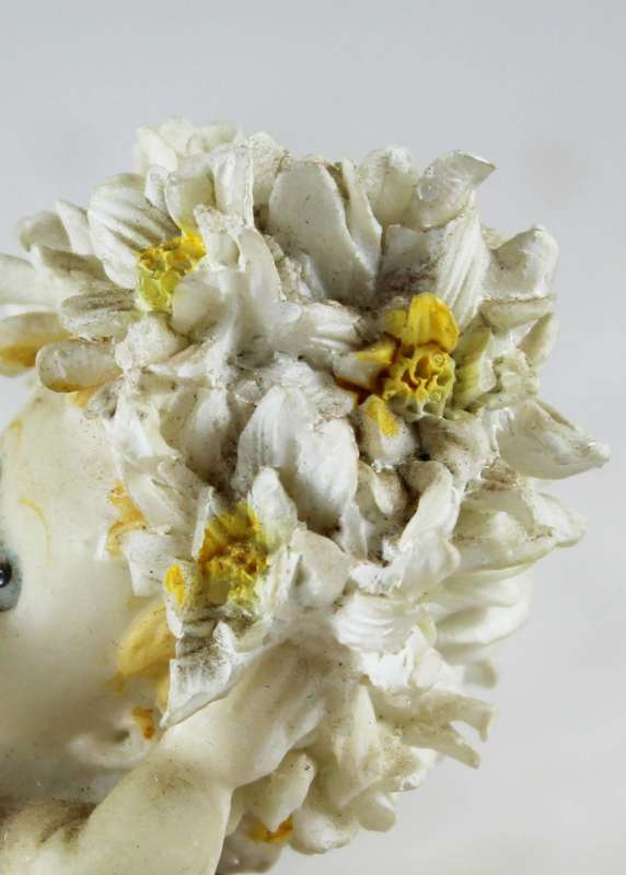 Baby with white and yellow flower hair
