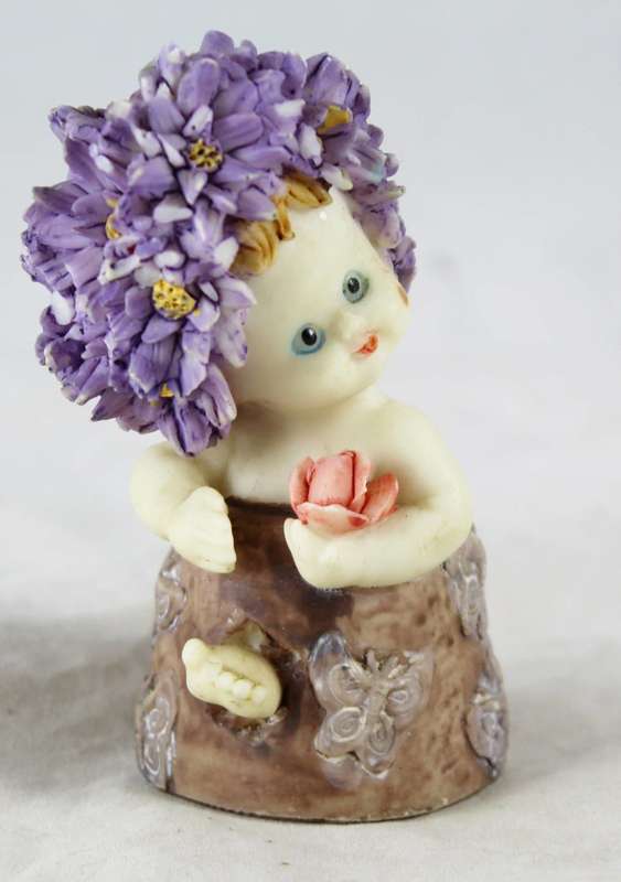 Baby with purple flower hair