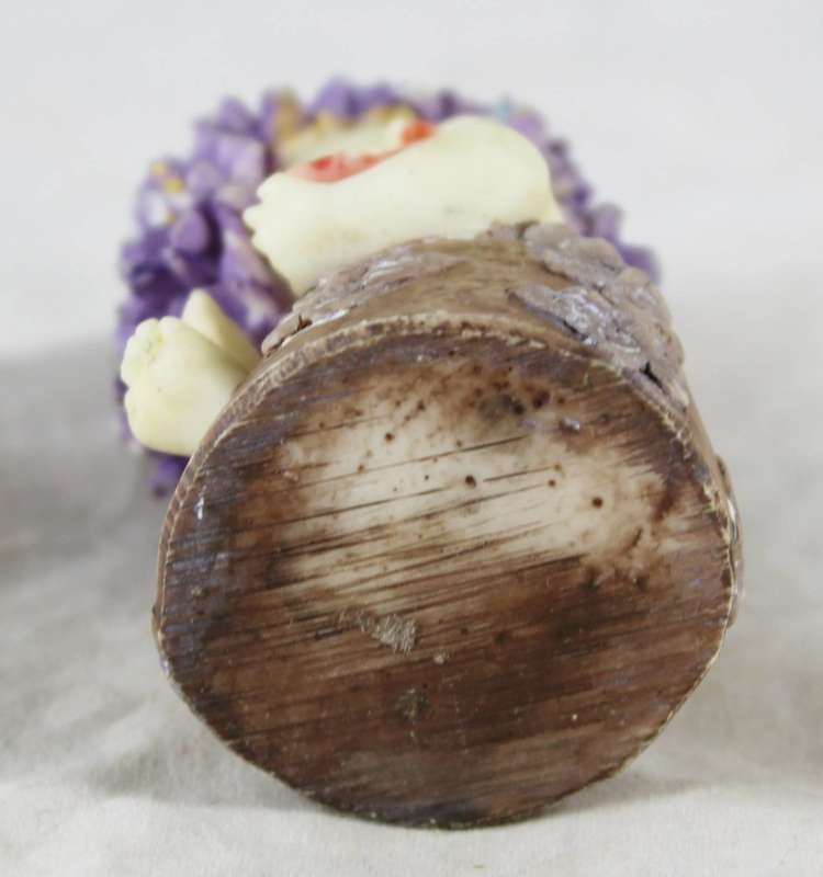 Baby with purple flower hair