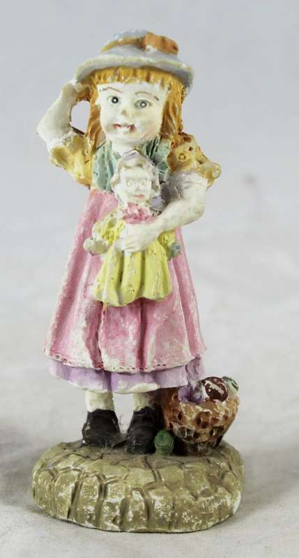 Little girl holding her doll