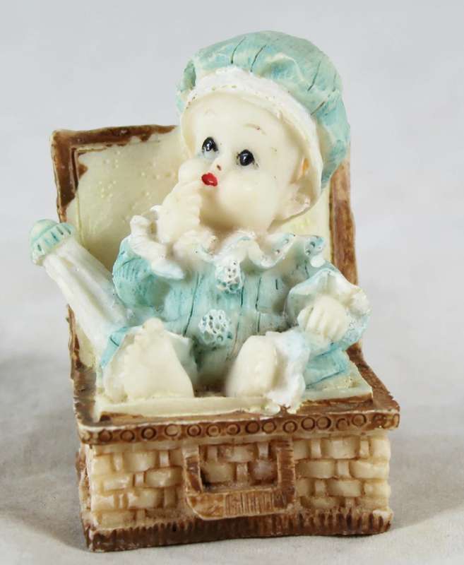 Seated baby in light blue