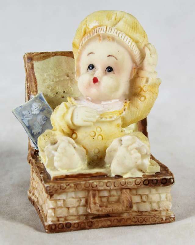 Seated baby in yellow