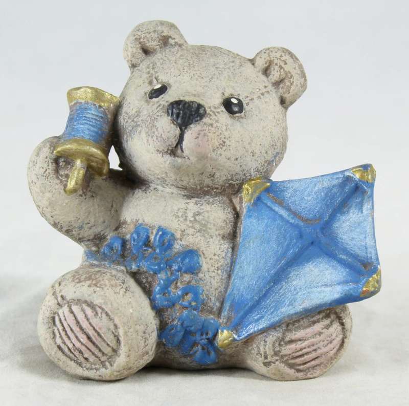 Bear with blue kite