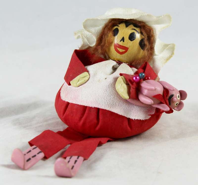 Girl in red pin cushion