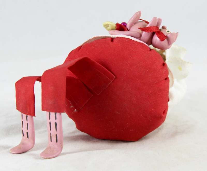 Girl in red pin cushion