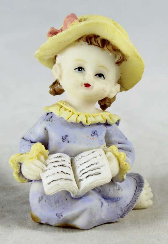 Little Girl Reading a Book