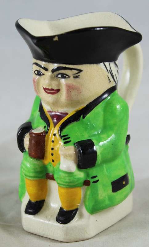 Small Character Jug Man in Green Jacket Drinking Beer