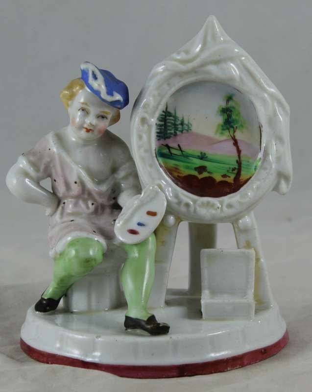Porcelain figurine artist with easel
