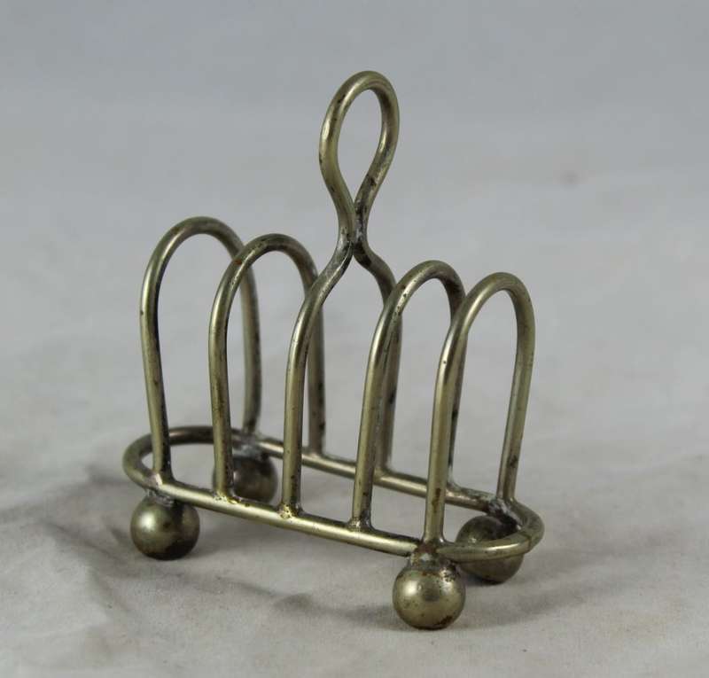 Very small silver plated bread rack