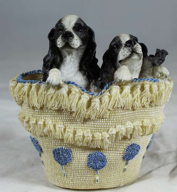 Cocker Spaniel puppies in a basket