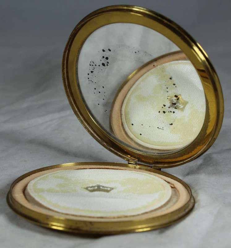 Domed rose embossed powder compact