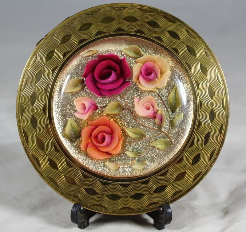 Domed rose embossed powder compact