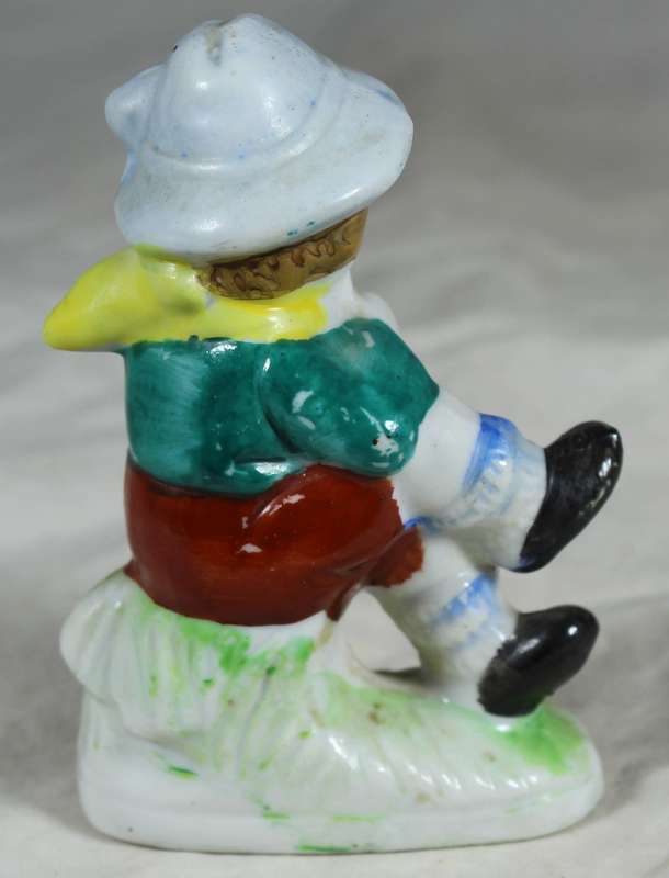 Ceramic boy playing his horn