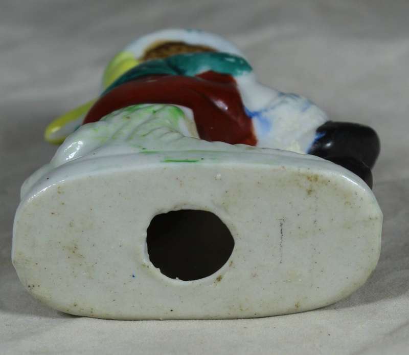 Ceramic boy playing his horn