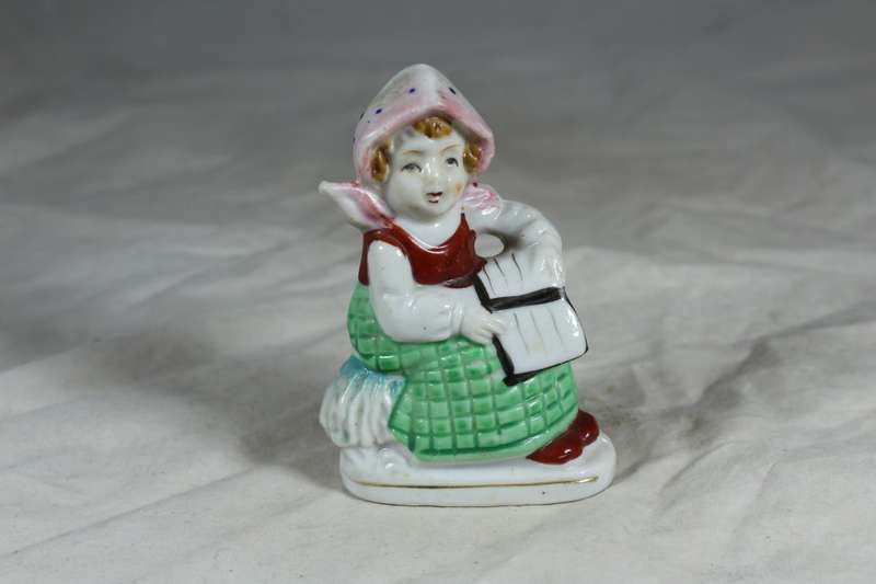Ceramic girl reading