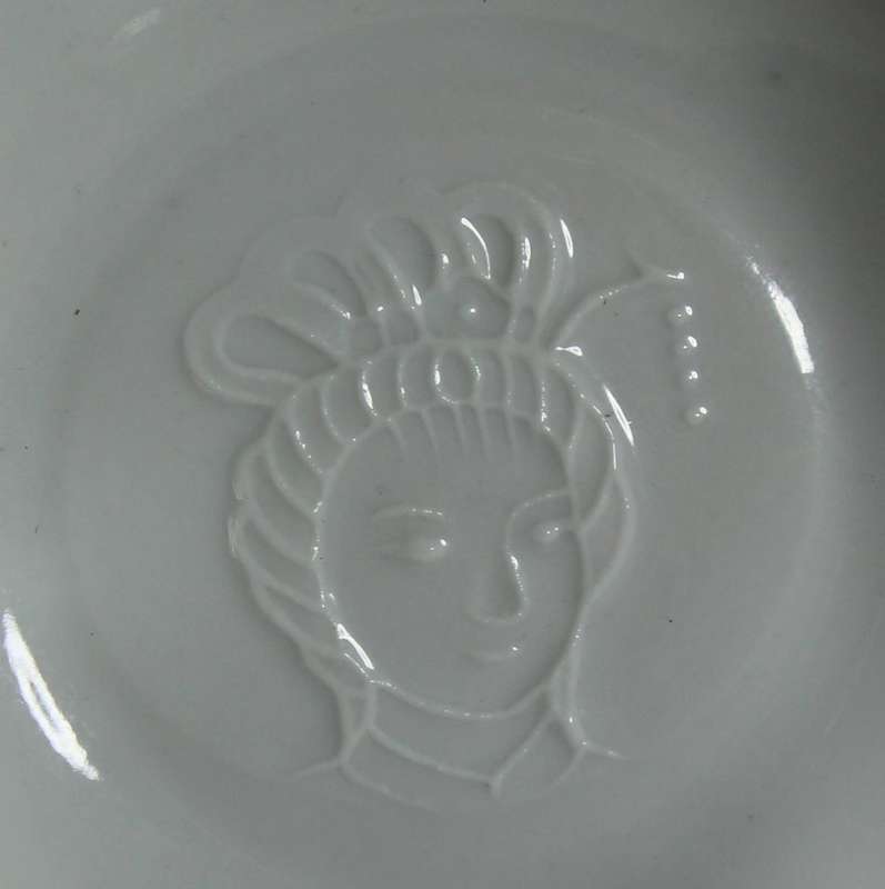 Very fine Emperors embossed face in cup