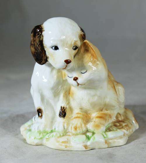 Loving cat and dog figurine