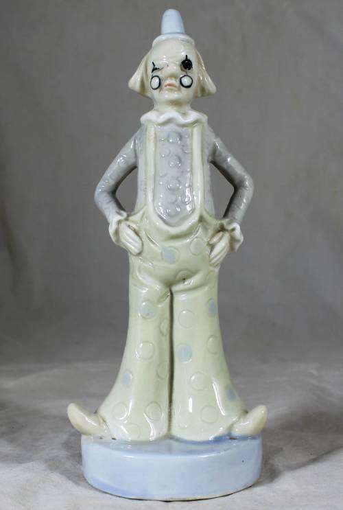 Porcelain clown dressed on cream