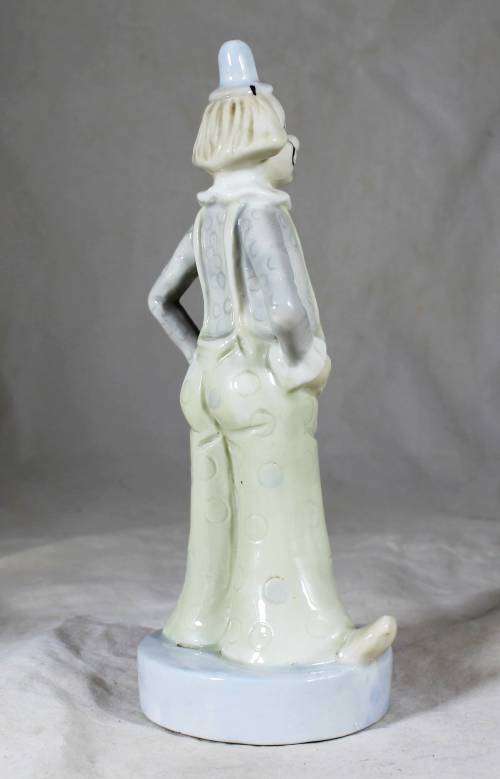 Porcelain clown dressed on cream