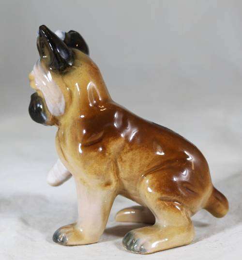 Porcelain puppy with bandaged foot