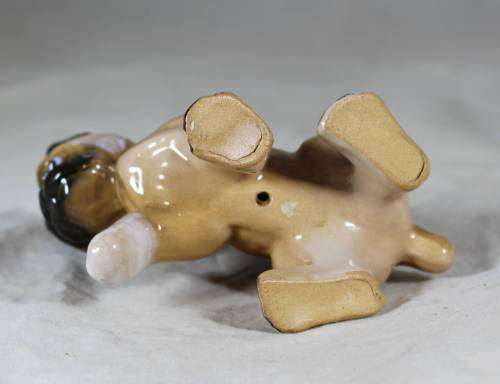 Porcelain puppy with bandaged foot