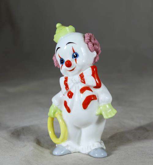 Maruri porcelain baby clown holding a large ring