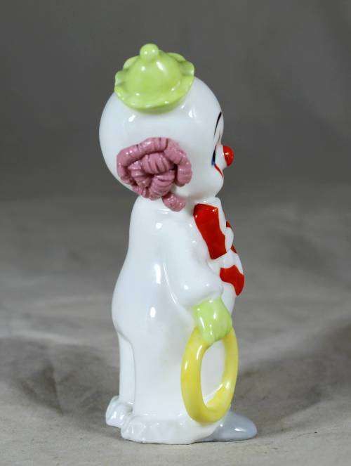 Maruri porcelain baby clown holding a large ring