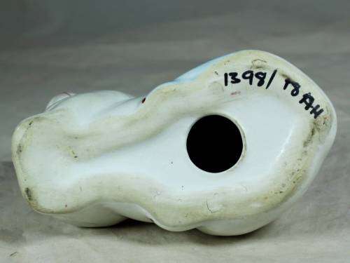 Porcelain cat lying down